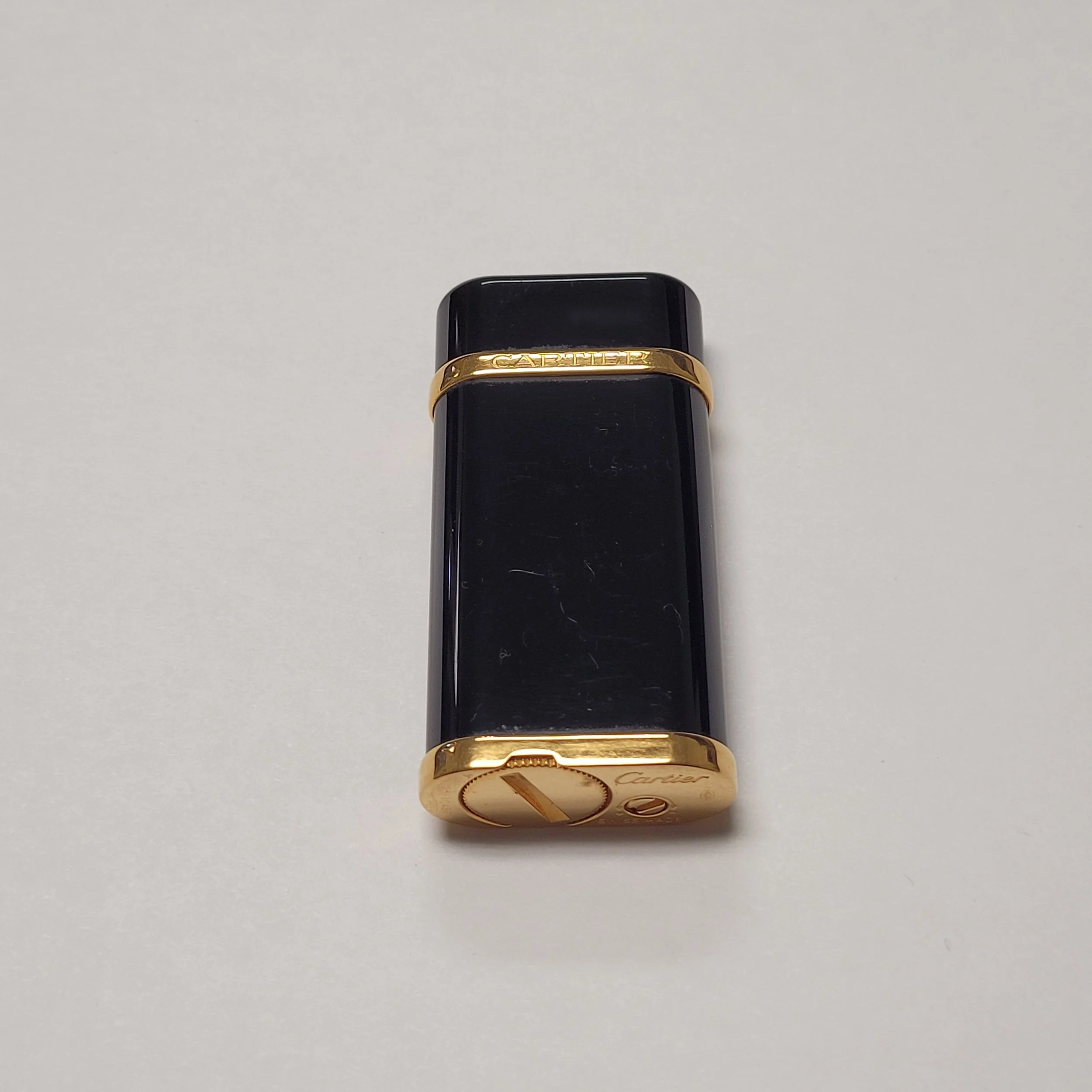 Cartier Gold Plated Black Enamel Elegant Lighters Selling repairing high end and vintage lighters since 1957 S.T. Dupont Alfred Dunhill IM Corona Zippo Ronson Evans Lighters more